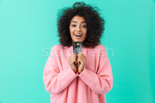Portrait of joyful american woman 20s with afro hairstyle demons Stock photo © deandrobot