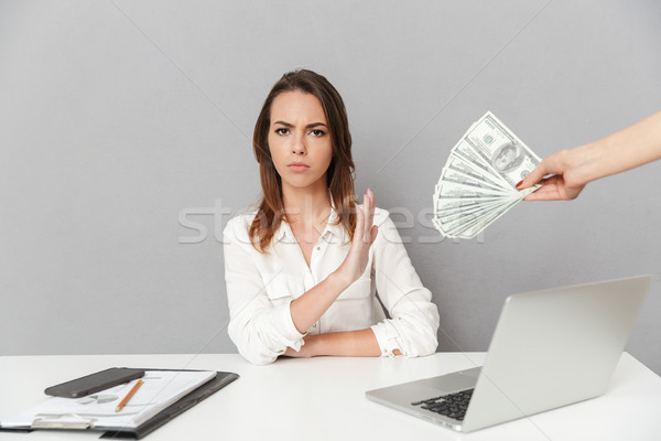 Portrait of a serious young business woman Stock photo © deandrobot