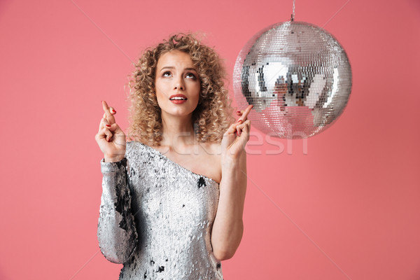 Portrait of a beautiful woman in shiny dress Stock photo © deandrobot