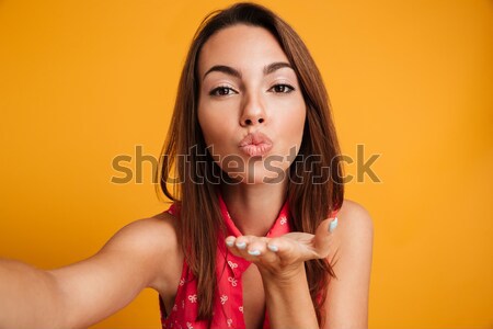 Attractive female model looking at camera  Stock photo © deandrobot