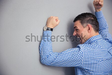 Man covering his nose and showing stop gesture with palm Stock photo © deandrobot