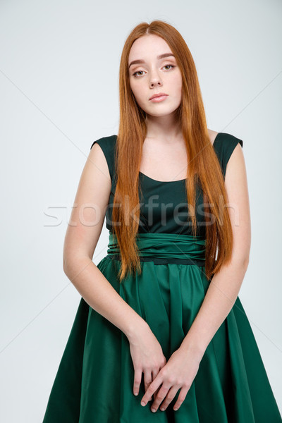 Sad woman in dress looking at camera Stock photo © deandrobot