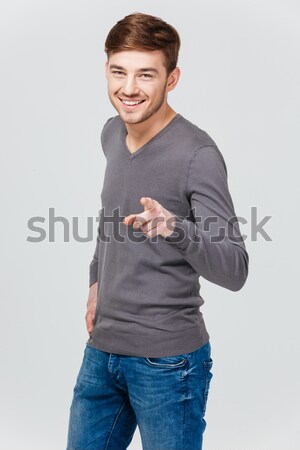 魅力的な 若い男 笑みを浮かべて ポインティング グレー ストックフォト © deandrobot