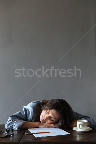 Sleeping woman writer lies indoors Stock photo © deandrobot