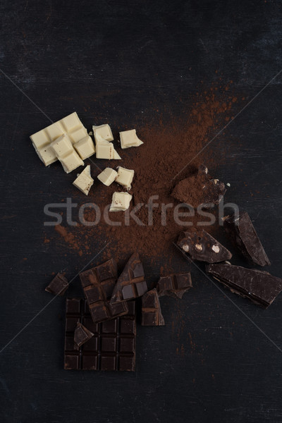 Top view of a chocolate bar crashed in pieces Stock photo © deandrobot