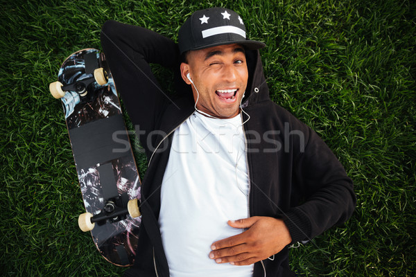 Top view of a cheerful young african male teenager Stock photo © deandrobot