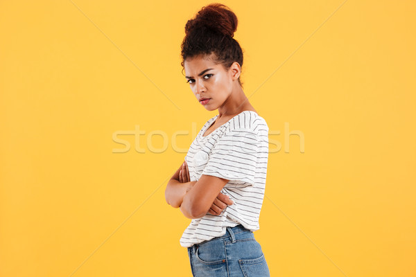 Angry displeased african lady holding hands folded isolated Stock photo © deandrobot