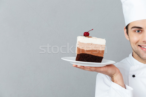 Cropped image of a smiling male chef dressed in uniform Stock photo © deandrobot