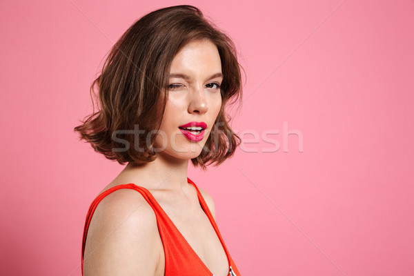 Close-up portrait of charming brunette woman with bright makeup  Stock photo © deandrobot