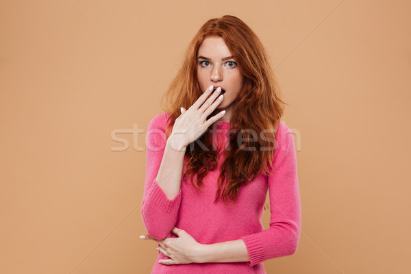 Close up portrait of an astonished young redhead girl Stock photo © deandrobot