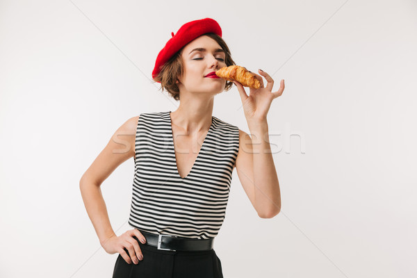 Portrait of a delighted woman wearing red beret Stock photo © deandrobot