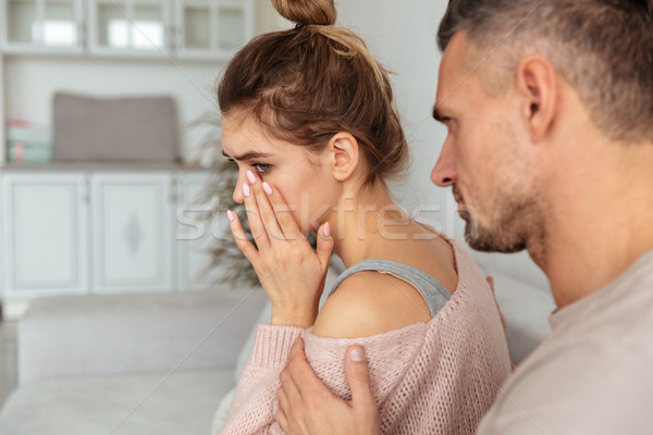 Back view of Careful man sitting on couch Stock photo © deandrobot