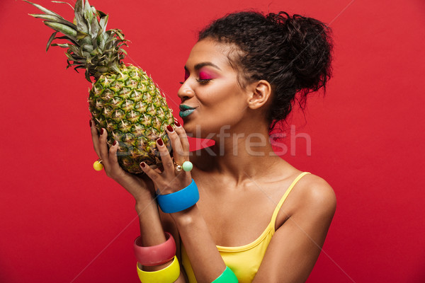 Mixed-race woman with fashion makeup in yellow shirt having deto Stock photo © deandrobot