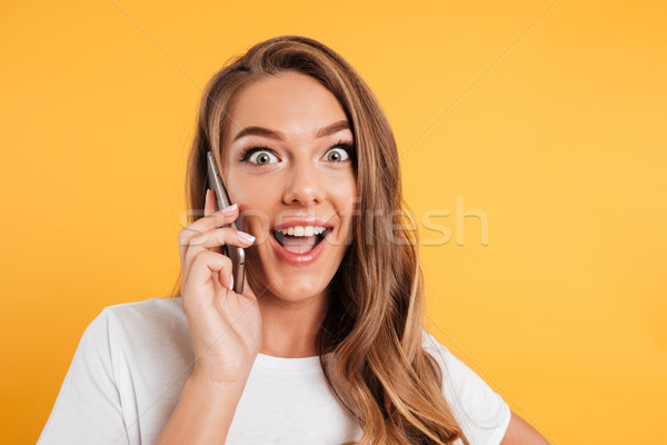 Stock photo: Close up portrait of an excited happy girl