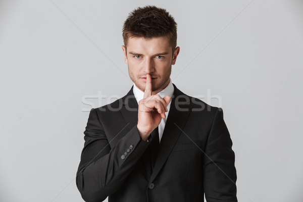 Portré fiatal üzletember öltöny mutat csend Stock fotó © deandrobot