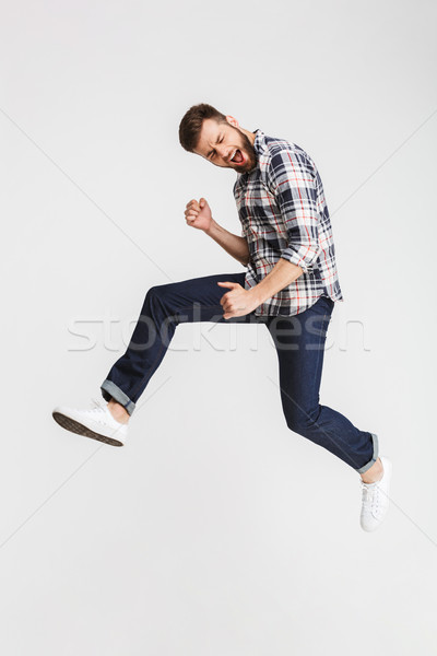 [[stock_photo]]: Portrait · excité · jeune · homme · sautant · célébrer