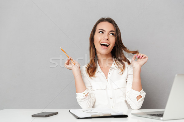 Portrait of a laughing young business woman Stock photo © deandrobot