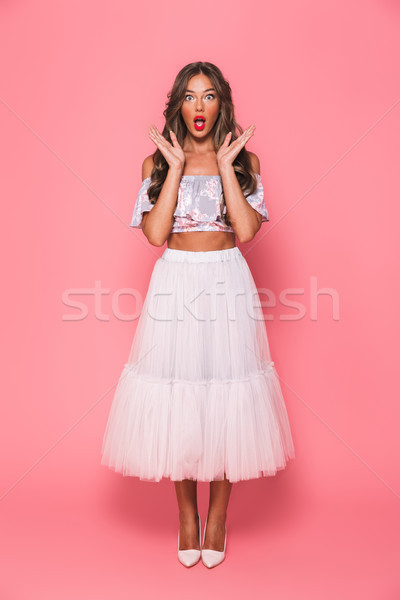 Stock photo: Full length portrait of surprising young woman 20s screaming and