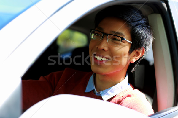 Handsome happy asian man sitting in car Stock photo © deandrobot
