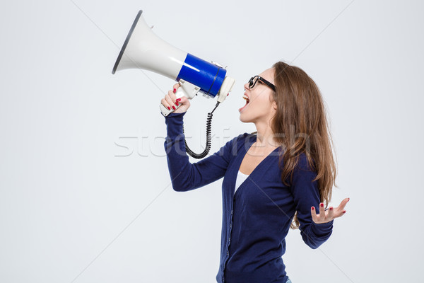 Beautiful woman shouting in loudspeaker Stock photo © deandrobot