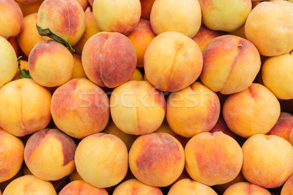 Fresh ripe peaches background Stock photo © deandrobot