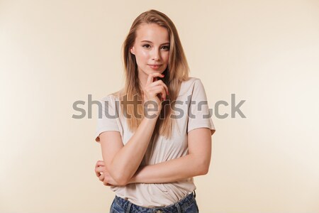 Figyelmes vonzó fiatal nő gondolkodik másfelé néz fehér Stock fotó © deandrobot