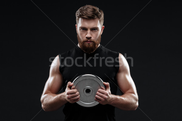 Trainer with weight plate Stock photo © deandrobot