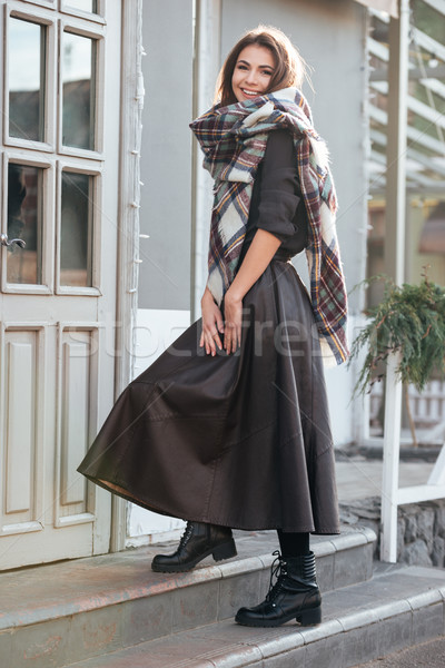Incredible lady looking at camera near cafe outdoors. Stock photo © deandrobot