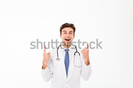 Portrait of a happy cheery male doctor Stock photo © deandrobot