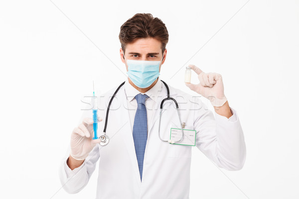 Close up portrait of a young male doctor Stock photo © deandrobot