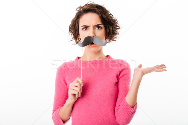 Portrait of a funny confused girl Stock photo © deandrobot