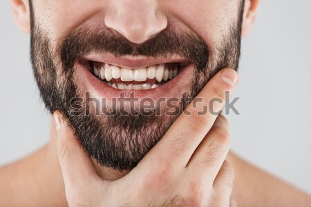 Close up portrait of bearded half men's face Stock photo © deandrobot