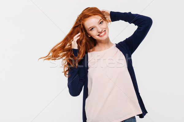 Smiling pretty young redhead lady Stock photo © deandrobot