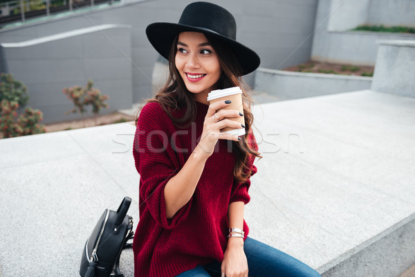 Portrait of a smiling happy asian girl wearing hat Stock photo © deandrobot