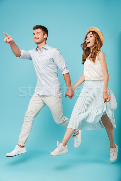 Emotional caucasian people man and woman jumping Stock photo © deandrobot