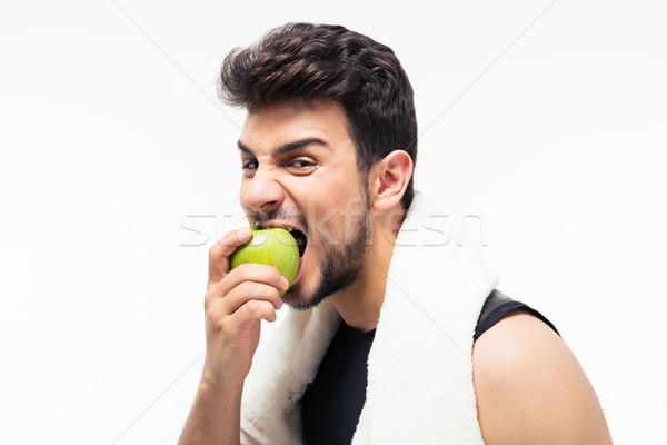 Fitness hombre comer manzana toalla aislado Foto stock © deandrobot