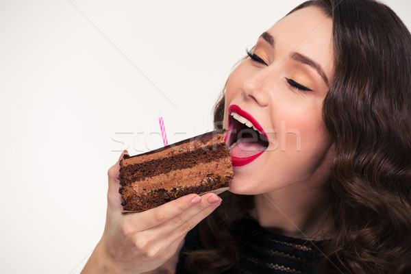 Aranyos lány eszik darab csokoládé születésnapi torta Stock fotó © deandrobot