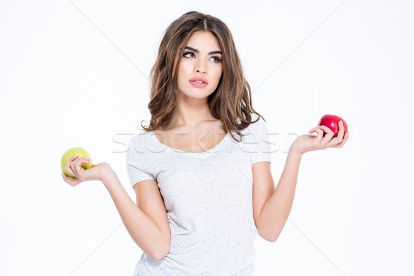 Bájos figyelmes nő tart kettő almák Stock fotó © deandrobot
