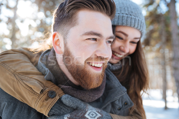 Couple having fun in winter park Stock photo © deandrobot
