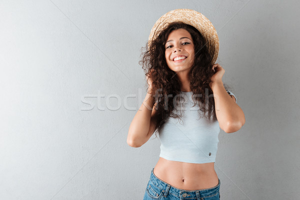 Sorridente mulher seis posando estúdio Foto stock © deandrobot