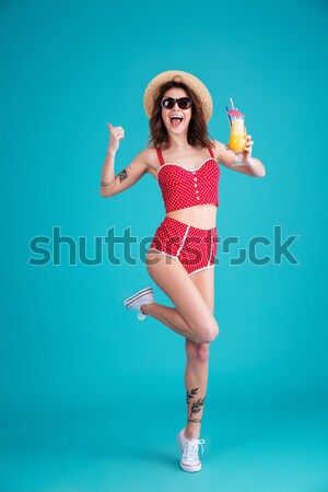 Full length portrait of a happy girl dressed in swimsuit Stock photo © deandrobot