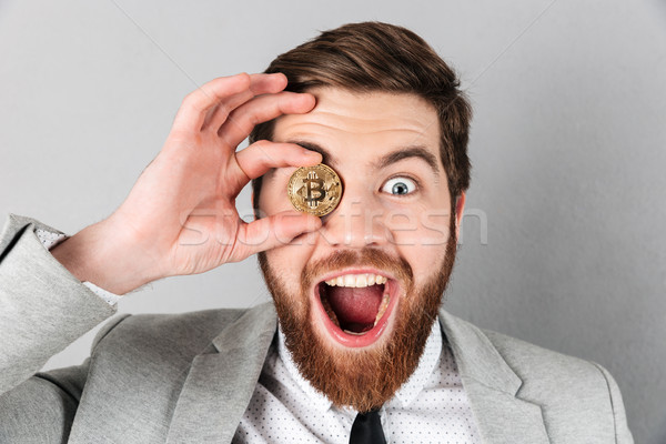 Close up a joyful businessman dressed in suit Stock photo © deandrobot
