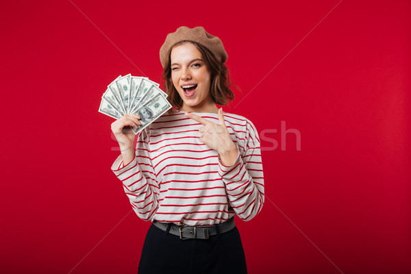 Portrait of an excited woman wearing beret Stock photo © deandrobot