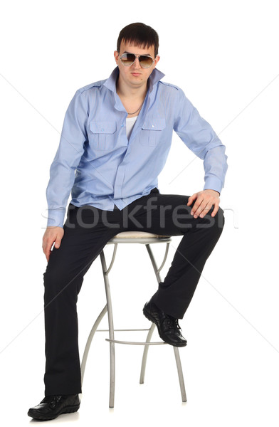 Adam oturma sandalye komik yalıtılmış beyaz Stok fotoğraf © DedMorozz