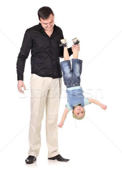 Man holds little boy upside down Stock photo © DedMorozz