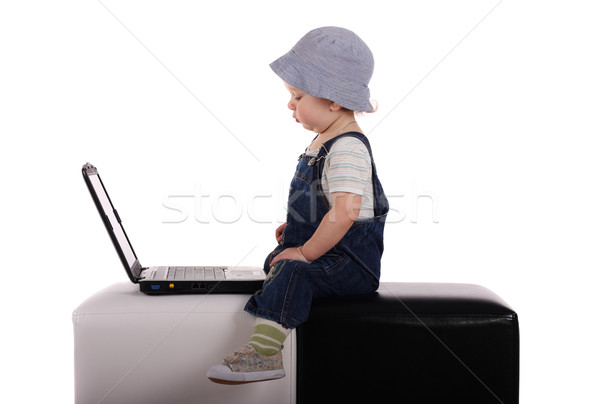 Küçük erkek dizüstü bilgisayar oturma yalıtılmış beyaz Stok fotoğraf © DedMorozz