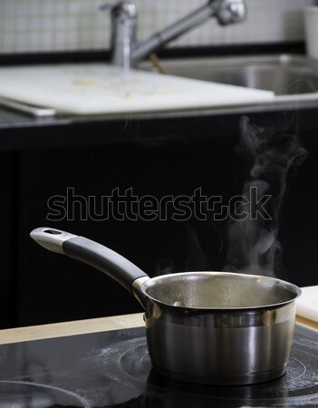 Little saucepan on the plate Stock photo © DedMorozz