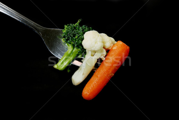 Broccoli conopida morcov furculiţă izolat negru Imagine de stoc © dehooks