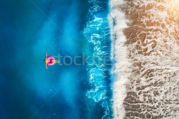 Femme natation mer jeune femme rose [[stock_photo]] © denbelitsky