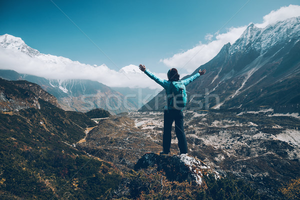 Landscape with happy girl, mountains, blue sky with clouds Stock photo © denbelitsky